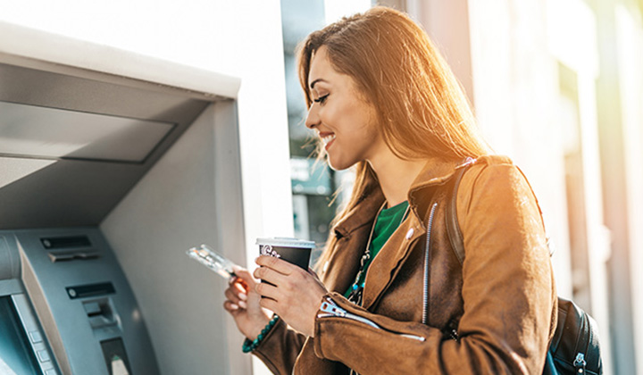 Photo of Lady at ATM Machine