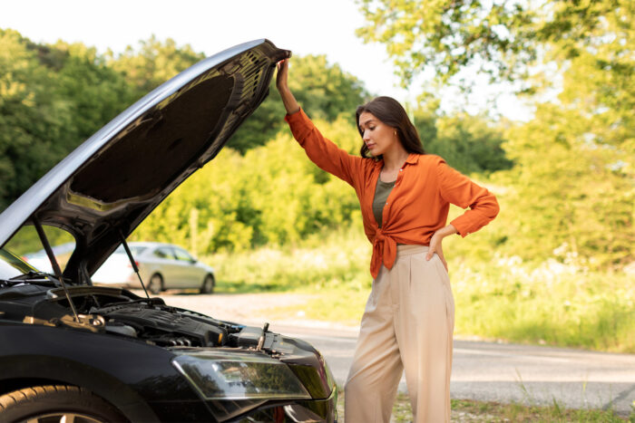 Photo of Lady with Car Hood Raised