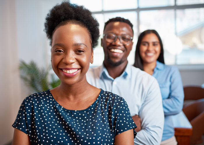 Photo of three people smiling